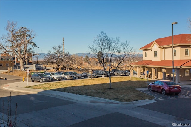 2876 W 53rd Ave Unit 106, Denver, CO 80221 - view of asphalt road featuring curbs, sidewalks, and street lights