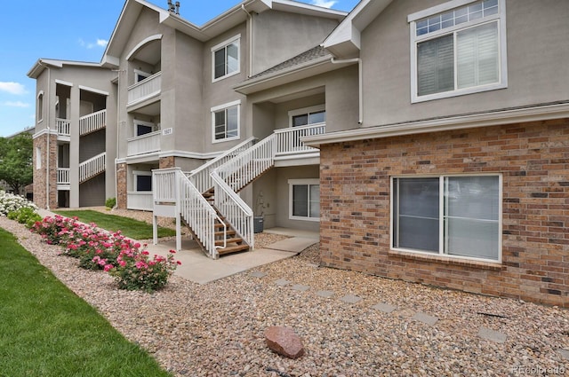 1801 S Dunkirk St Unit 108, Aurora, CO 80017 - view of property featuring stairway