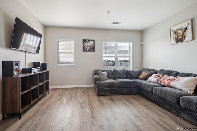 18726 E Yale Cir Unit D, Aurora, CO 80013 - living area with light wood-style flooring and baseboards