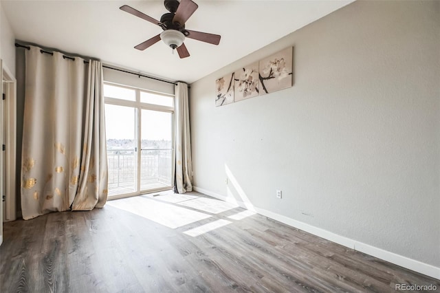 18726 E Yale Cir Unit D, Aurora, CO 80013 - unfurnished room featuring wood finished floors, ceiling fan, and baseboards