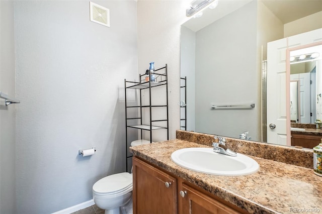 18726 E Yale Cir Unit D, Aurora, CO 80013 - bathroom featuring vanity and toilet
