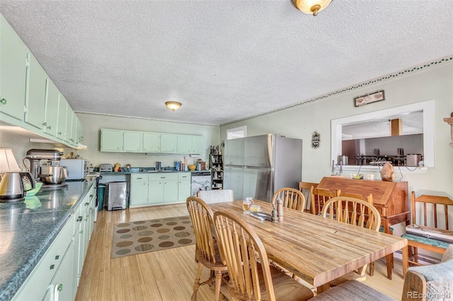 237 Foxtail Ct, Fairplay, CO 80440 - dining room featuring a textured ceiling and light wood-style flooring