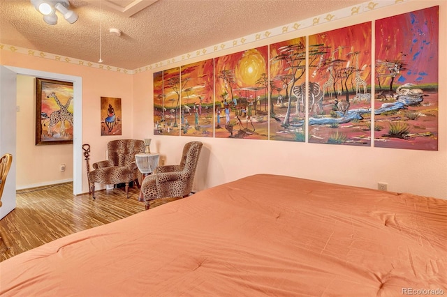 237 Foxtail Ct, Fairplay, CO 80440 - bedroom with wood finished floors and a textured ceiling