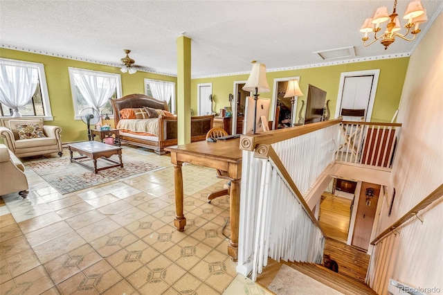 237 Foxtail Ct, Fairplay, CO 80440 - living room with a textured ceiling, a ceiling fan, and baseboard heating