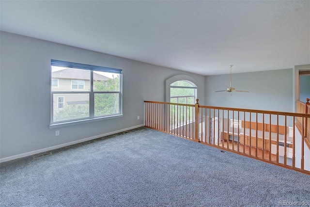 8545 Braun Loop, Arvada, CO 80005 - empty room featuring a ceiling fan, carpet, and baseboards
