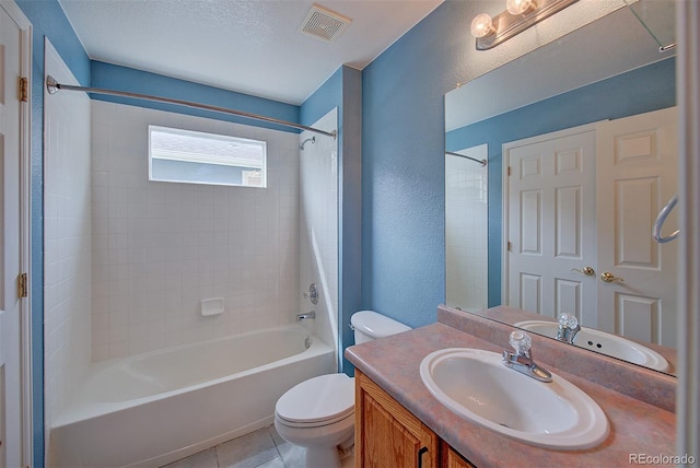 8545 Braun Loop, Arvada, CO 80005 - full bath featuring toilet, bathing tub / shower combination, vanity, a textured wall, and tile patterned floors