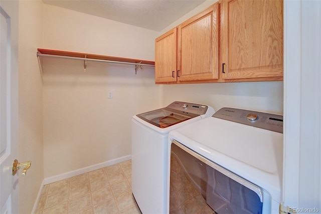 8545 Braun Loop, Arvada, CO 80005 - clothes washing area featuring separate washer and dryer, cabinet space, and baseboards