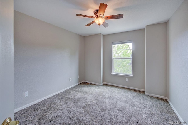 8545 Braun Loop, Arvada, CO 80005 - spare room with carpet floors, a ceiling fan, and baseboards