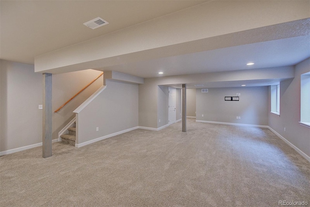 8545 Braun Loop, Arvada, CO 80005 - basement featuring carpet floors, stairway, baseboards, and recessed lighting