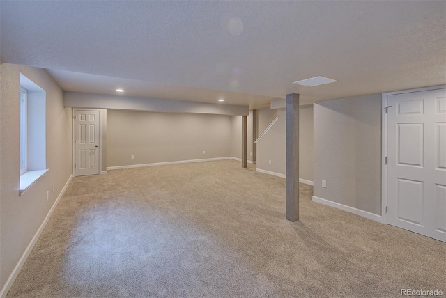 8545 Braun Loop, Arvada, CO 80005 - finished below grade area featuring light colored carpet, recessed lighting, and baseboards