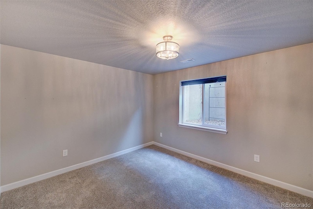 8545 Braun Loop, Arvada, CO 80005 - unfurnished room featuring carpet floors, a chandelier, baseboards, and a textured ceiling