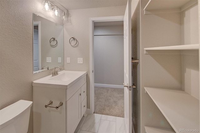 8545 Braun Loop, Arvada, CO 80005 - bathroom featuring toilet and vanity
