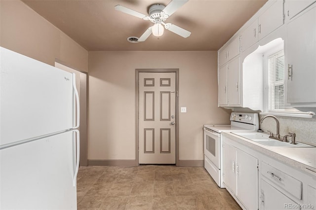 kitchen featuring white cabinetry, sink, white appliances, and ceiling fan