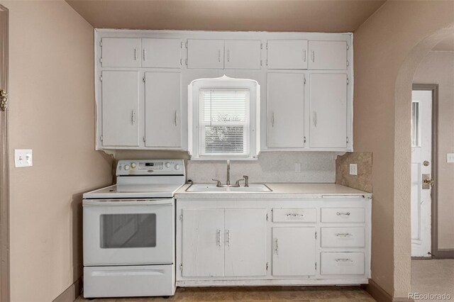 kitchen with white cabinetry, sink, backsplash, and white range with electric stovetop