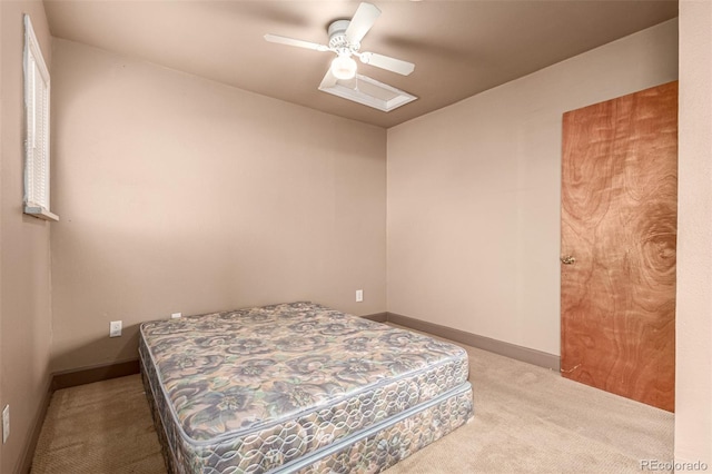 bedroom featuring ceiling fan and light colored carpet