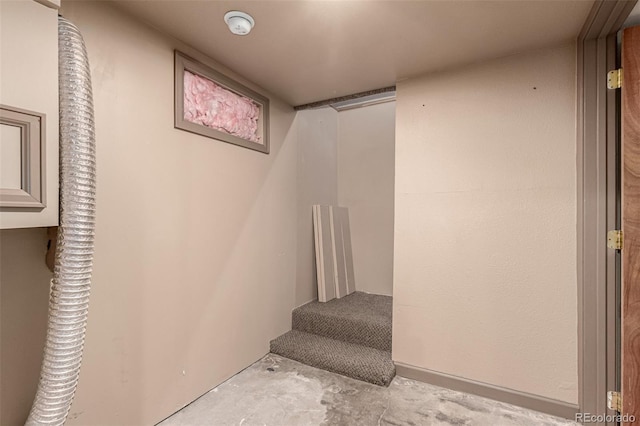 stairway with concrete floors