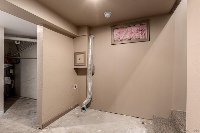 clothes washing area featuring hookup for an electric dryer and water heater