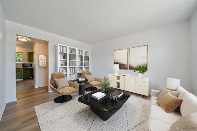 16251 E 17th Pl Unit C, Aurora, CO 80011 - living room featuring wood finished floors and baseboards