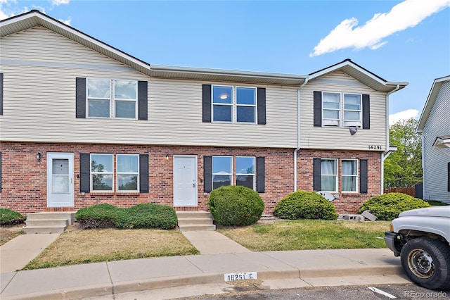 16251 E 17th Pl Unit C, Aurora, CO 80011 - multi unit property featuring brick siding and entry steps