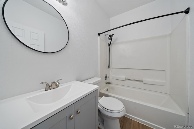 16251 E 17th Pl Unit C, Aurora, CO 80011 - bathroom with toilet, vanity,  shower combination, and wood finished floors