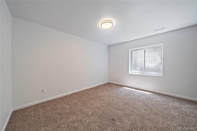 16251 E 17th Pl Unit C, Aurora, CO 80011 - carpeted empty room with baseboards