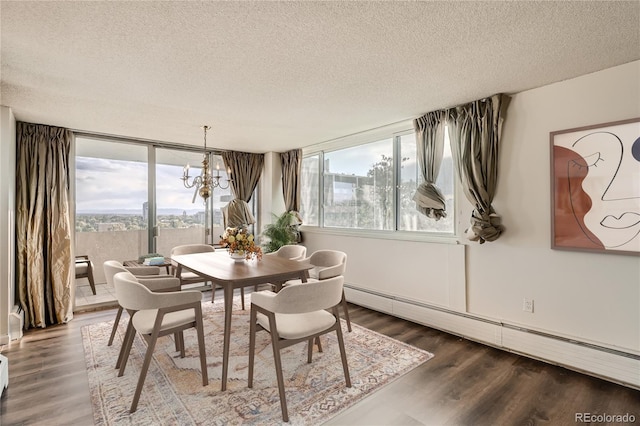 dining space featuring a textured ceiling, baseboard heating, and a healthy amount of sunlight