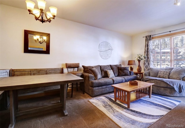 carpeted living area with a chandelier