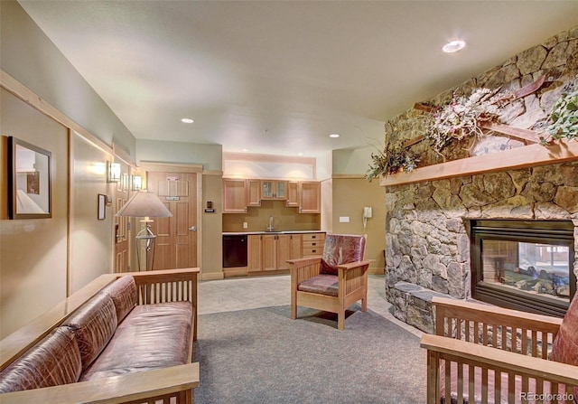 living room with light carpet, a fireplace, and recessed lighting