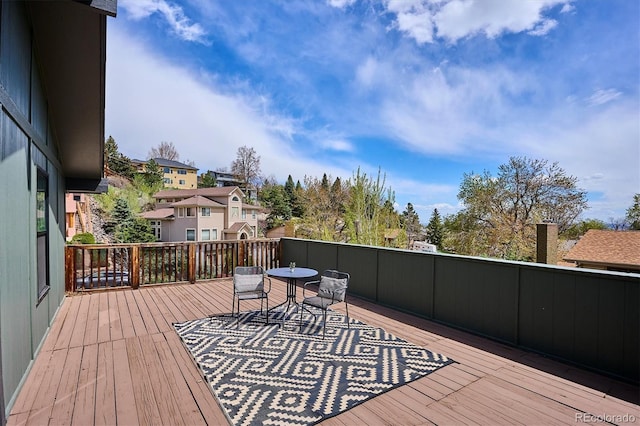 wooden terrace with a residential view