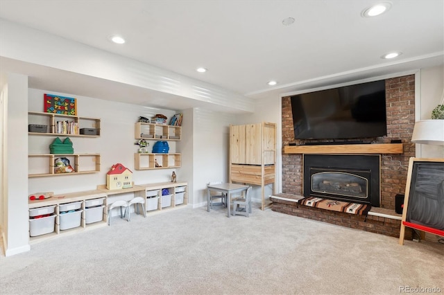 interior space with baseboards, a fireplace, and recessed lighting