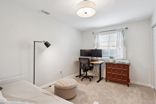 bedroom featuring baseboards, light carpet, and visible vents