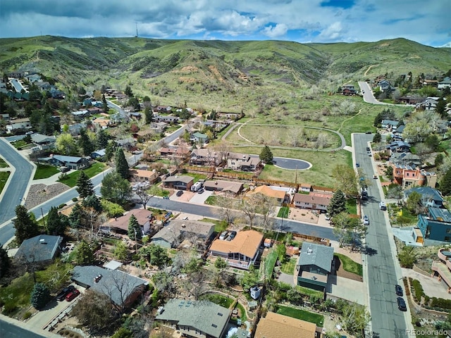 drone / aerial view featuring a residential view and a mountain view