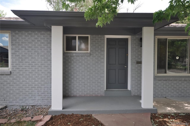 doorway to property featuring a porch