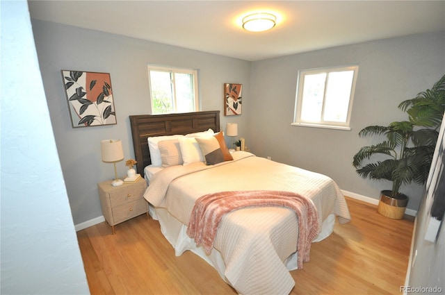 bedroom with light hardwood / wood-style flooring