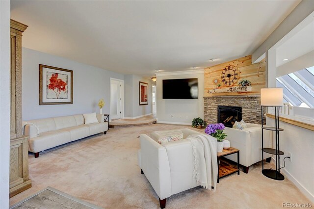 18045 Sunburst Dr, Monument, CO 80132 - living room featuring light carpet, a stone fireplace, and baseboards