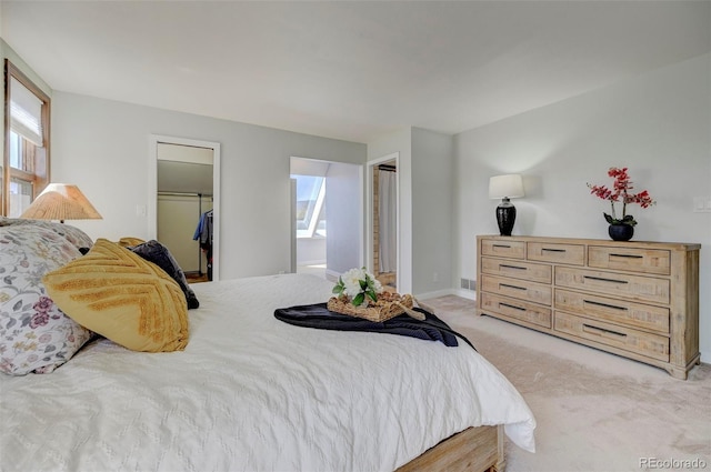 18045 Sunburst Dr, Monument, CO 80132 - bedroom featuring light carpet, a spacious closet, a closet, and baseboards