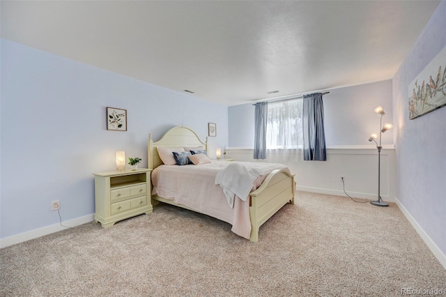 18045 Sunburst Dr, Monument, CO 80132 - bedroom featuring light carpet and baseboards