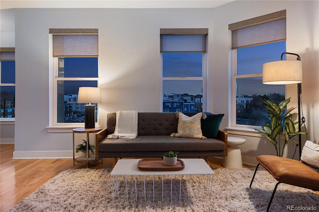 living room with wood finished floors and baseboards