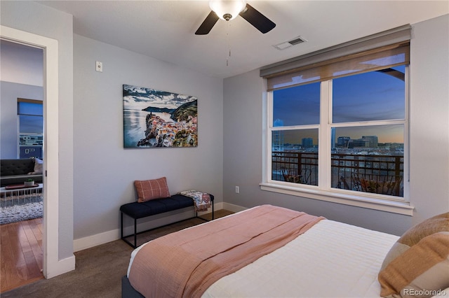 bedroom with a ceiling fan, carpet flooring, baseboards, and visible vents