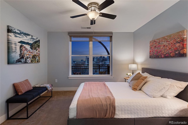 carpeted bedroom featuring visible vents, ceiling fan, and baseboards