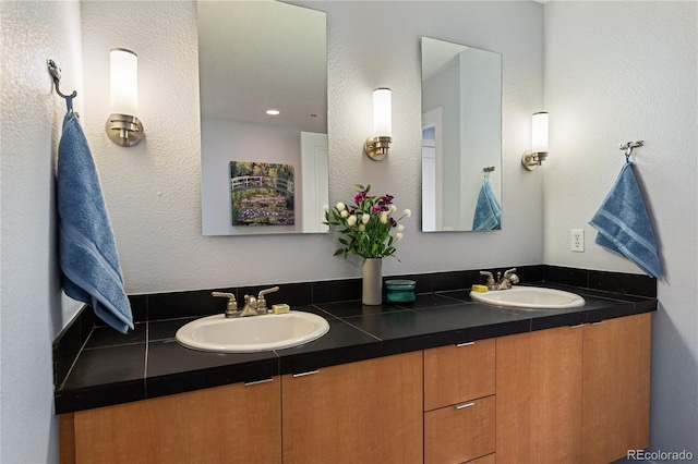 bathroom featuring double vanity and a sink