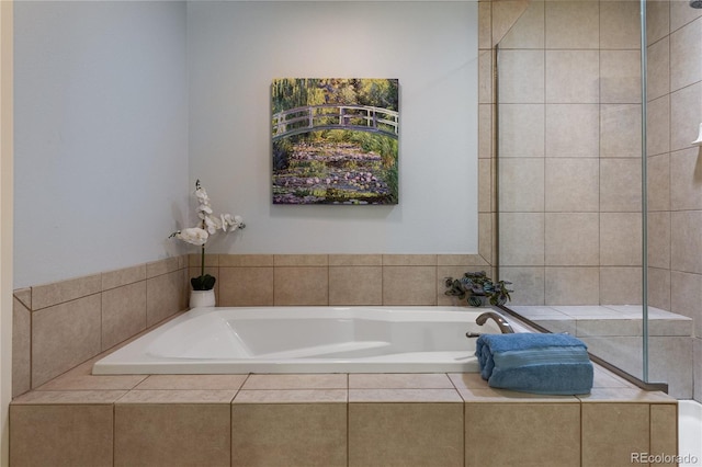 bathroom with a garden tub