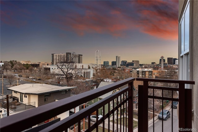 balcony at dusk with a city view