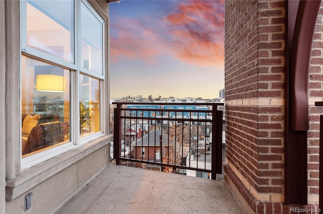 balcony at dusk with a city view