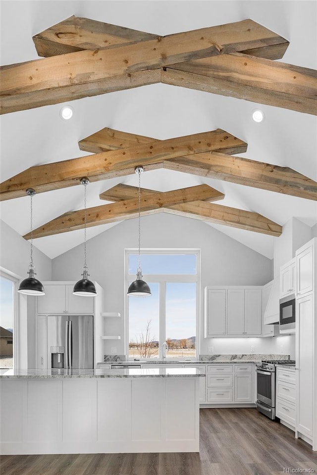 kitchen with white cabinetry, stainless steel appliances, and decorative light fixtures