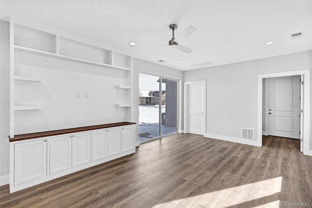 unfurnished living room with ceiling fan and wood-type flooring