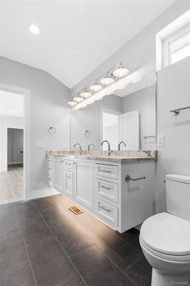 bathroom with toilet and vanity