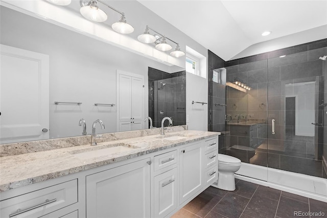 bathroom with toilet, lofted ceiling, tile patterned floors, an enclosed shower, and vanity