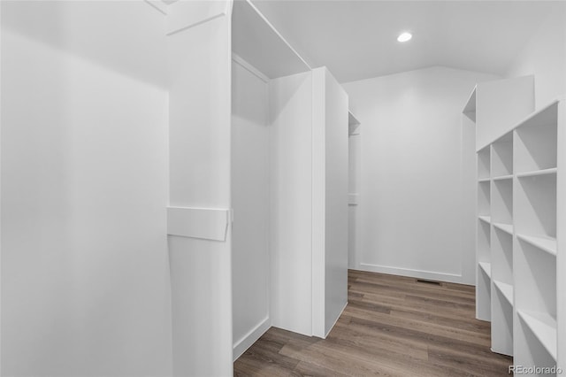 spacious closet with hardwood / wood-style floors