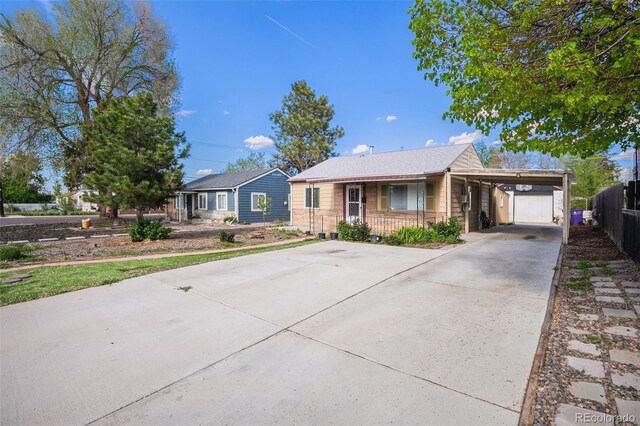 1910 S King St, Denver, CO 80219 - single story home featuring concrete driveway, covered porch, and a carport
